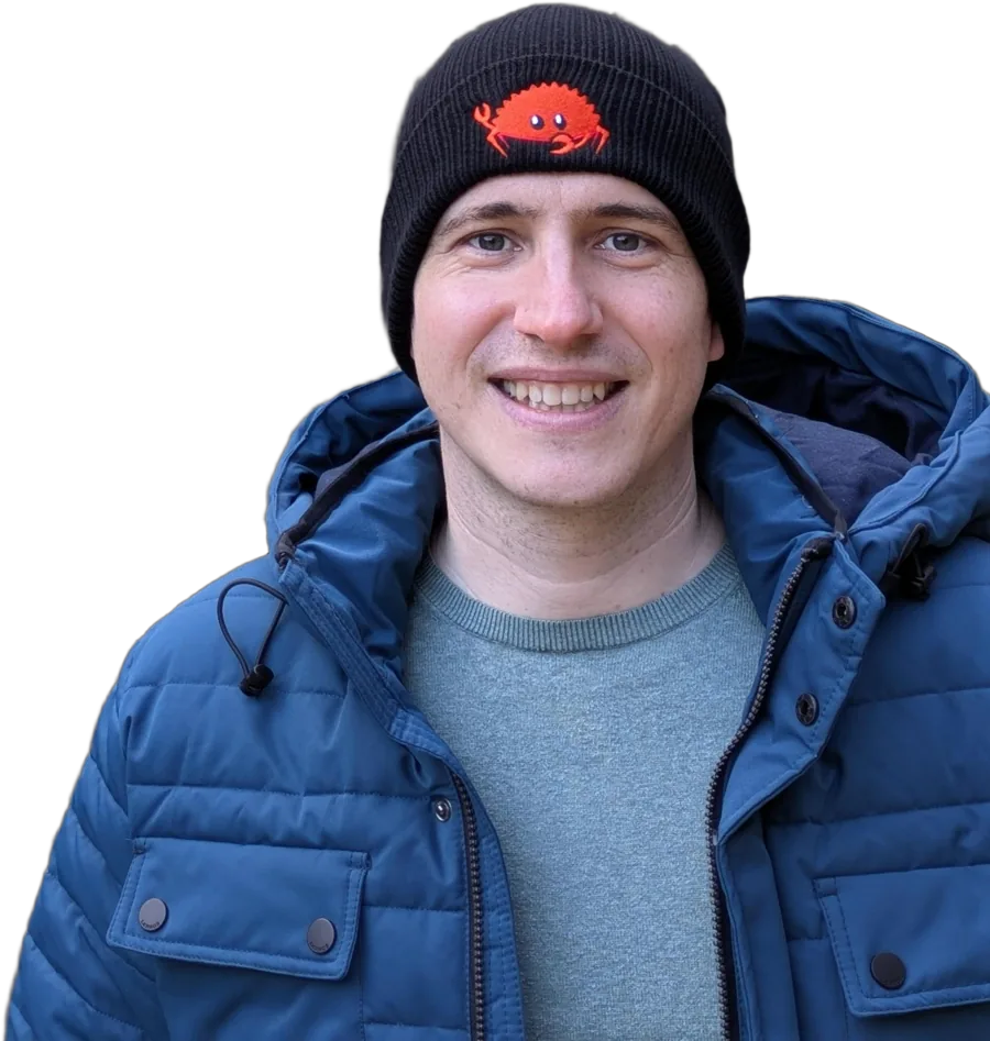 Hauke Jung wearing a beanie with Ferris, the Rust crab